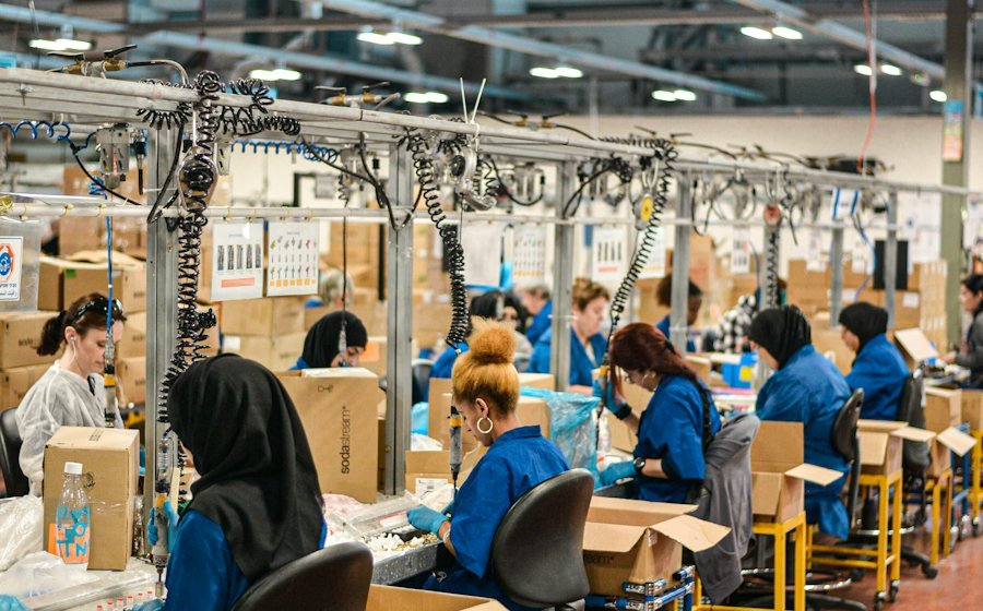 Workers on a factory assembly and packing line