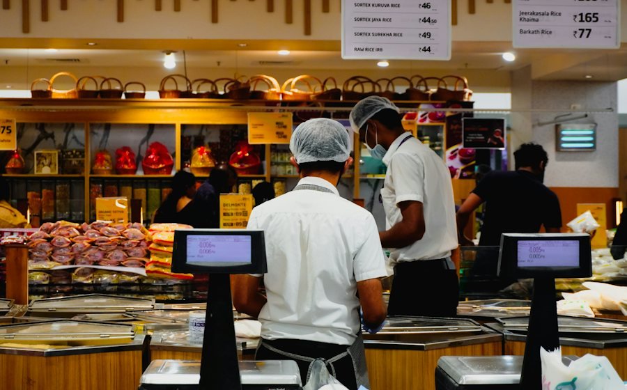Staff at a store checkout counter